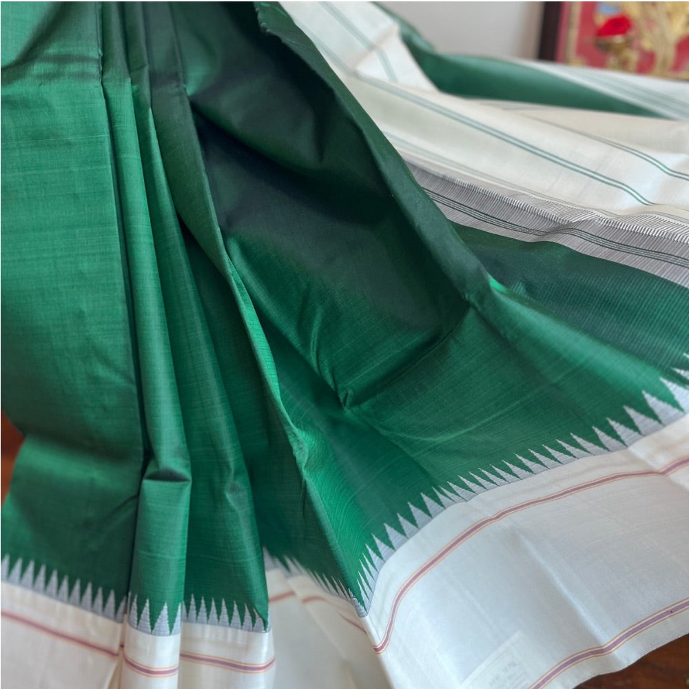 Bottle Green with off white in Temple border in korvai Kanchipuram silks