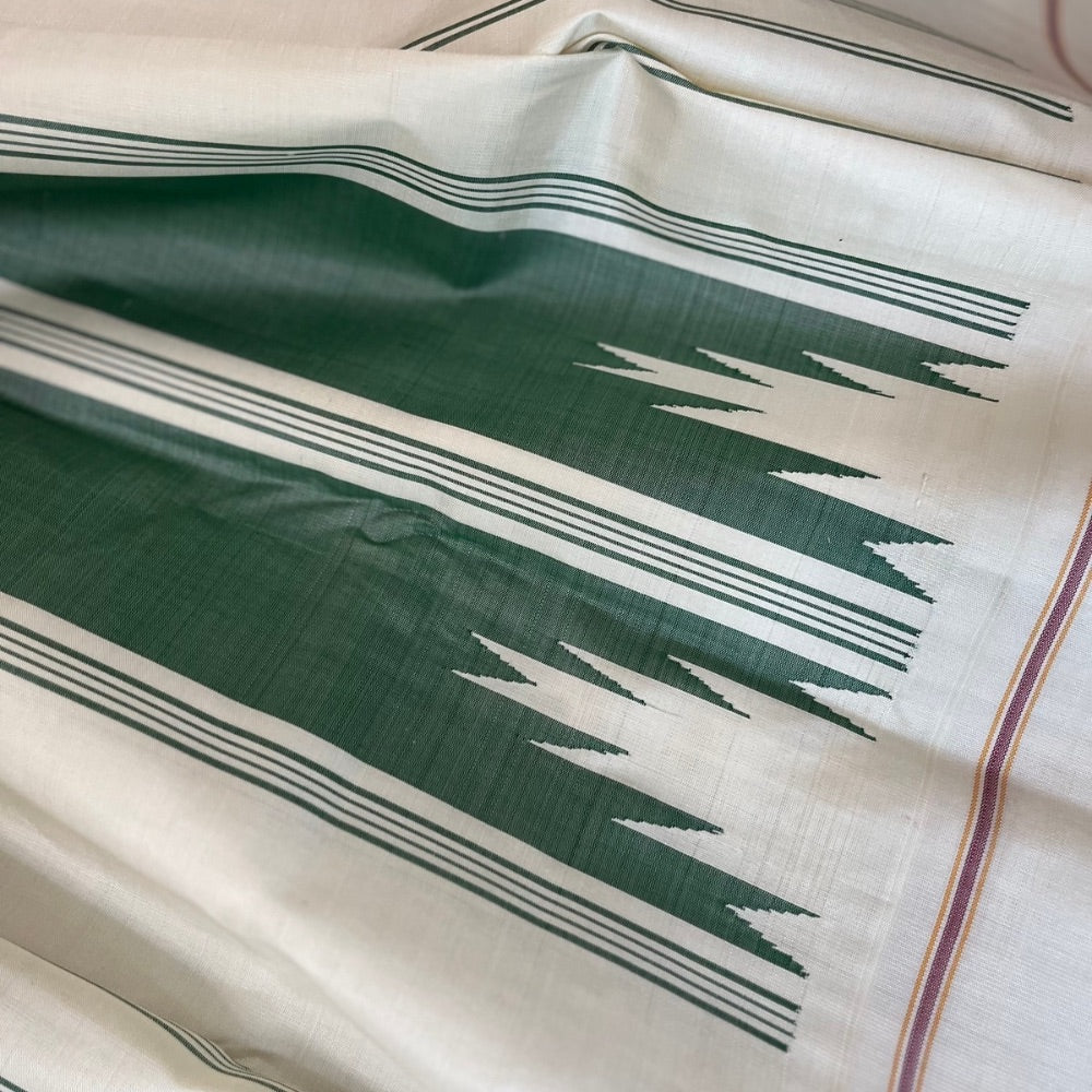 Bottle Green with off white in Temple border in korvai Kanchipuram silks