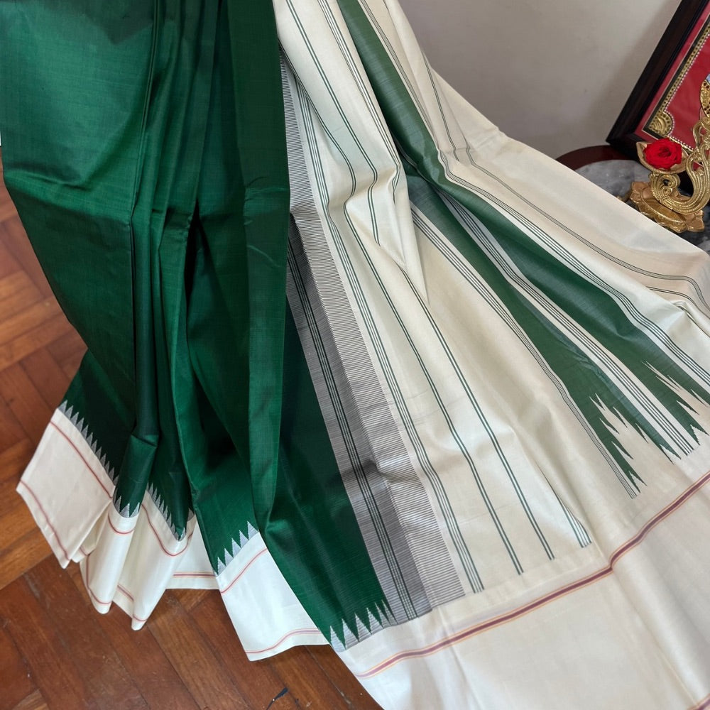 Bottle Green with off white in Temple border in korvai Kanchipuram silks