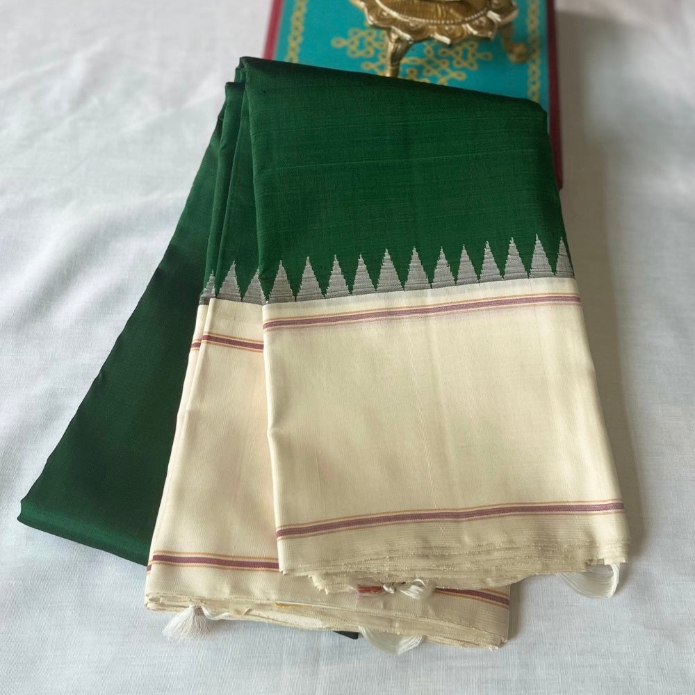 Bottle Green with off white in Temple border in korvai Kanchipuram silks