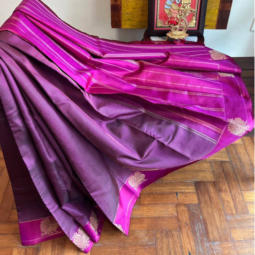 Deep maroon with pink border and zari pallu with Mayil chankram motif on border