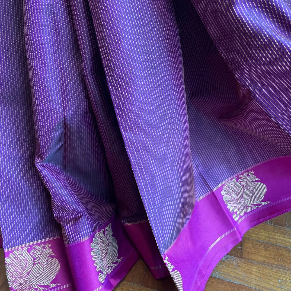 Deep maroon with pink border and zari pallu with Mayil chankram motif on border